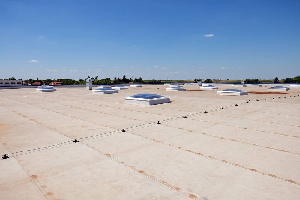 Flat commercial roof repair by HP Roofing Pro